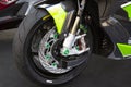 Motorcycle wheels with car accessories in showroom