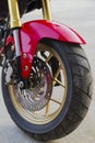 Motorcycle wheels parked in a road.