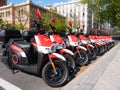Motorcycles of the company Acciona Motosharing parked on a street in Madrid due to a temporary stoppage of the mobility service Royalty Free Stock Photo