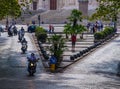 Motorcycles driving through street in Rome