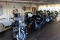 Motorcycles lined up in a ferry on a sunny day