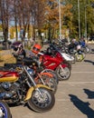 motorcycles lined up on the sidewalk at the closing of the motorcycle season in autumn