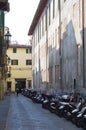 Motorcycles parked in alley Royalty Free Stock Photo