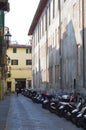 Motorcycles parked in alley