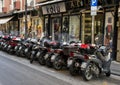 Motorcycles parked on a main shopping street in Sorrento, Italy