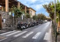 Motorcycles parked on a narrow street in Sorrento, Italy