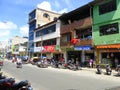 Motorcycles and shops on city street