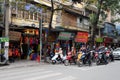 Motorcycles parking at traffic light in Hanoi old quarter, Vietnam. Royalty Free Stock Photo