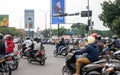 Motorcycles at a traffic light intersection around Kiara Condong road, Bandung, Indonesia.