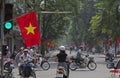 Motorcycles traveling on a messy cross street