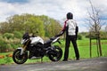 Motorcyclist biker on the road looking at nature Royalty Free Stock Photo