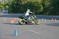 Motorcyclist cool maneuvering around obstacles on road.