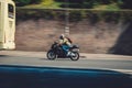 Motorcyclist driving fast in Rome.