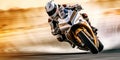 A motorcyclist in full uniform rides at high speed on a sports motorcycle. Motorsport Royalty Free Stock Photo