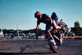 Motorcyclist making doing a difficult and dangerous stunt on his motorbike