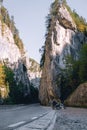 Motorcyclist man on adventure motorbike on mountain road in Bicaz Canyon, Romania. Tourism and vacation concept, moto way, Royalty Free Stock Photo