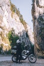 Motorcyclist man on adventure motorbike on mountain road in Bicaz Canyon, Romania. Tourism and vacation concept, moto way, Royalty Free Stock Photo