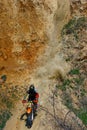 motorcyclist on a motorcycle rides down the mountain