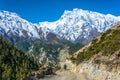 Motorcyclist on a mountain road in the Himalayas, Nepal. Royalty Free Stock Photo