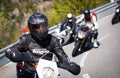 Motorcyclist racers in alps