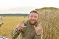 Motorcyclist racing his motorcycle down straight country road going a high speed at sunset. Military style biker Royalty Free Stock Photo