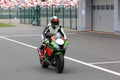 Motorcyclist on a racing motorcycle back to the pits