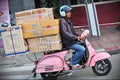 Motorcyclist Rides an Overloaded Vespa