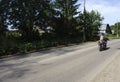 A motorcyclist rides on the road