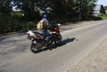 A motorcyclist rides on the road