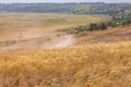 Motorcyclist rides on a wild hills. Motocross bike on beautiful rural landscape witj cloudy sky background,motorcycle 4K Royalty Free Stock Photo