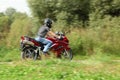 Motorcyclist riding on country road Royalty Free Stock Photo