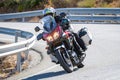 motorcyclist riding on his motorcycle on the road taking a sharp curve Royalty Free Stock Photo