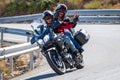 motorcyclist riding on his motorcycle on the road taking a sharp curve Royalty Free Stock Photo