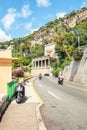 A motorcyclist and scooter rider on the Boulevard Napoleon III i