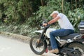 Motorcyclist starting his journey after resting