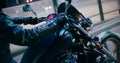 Motorcyclist Starts Ride on lights on Motorcycle at night. Freedom and Manhood