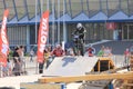 Motorcyclist on track juming on a ramp