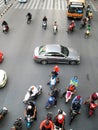 Motorcyclists and cars wait at a junction during rush hour Royalty Free Stock Photo