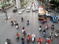 Motorcyclists and cars wait at a junction during rush hour Royalty Free Stock Photo