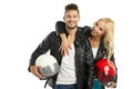 Motorcyclists couple with helmets in hand Royalty Free Stock Photo