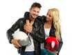 Motorcyclists couple with helmets in hand Royalty Free Stock Photo