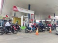 Motorcyclists are lining up to refuel at Pertamina fuel stations
