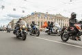 Motorcyclists passing along Nevsky Prospekt.