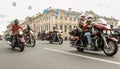 Motorcyclists passing along Nevsky Prospekt.
