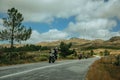 Motorcyclists passing by on the road