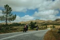 Motorcyclists passing by on the road