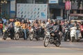 Motorcyclists stand at red traffic lights in India Royalty Free Stock Photo