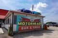 Motorheads bar and restaurant where the decor is made up of old signs, cars and parts Royalty Free Stock Photo