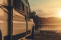 Motorhome Camper Van Camping Next to the Bay at Sunset Royalty Free Stock Photo