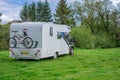 Motorhome campers parked in a camp in early spring